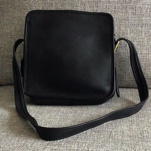 Coach black smooth leather cross-body bag.